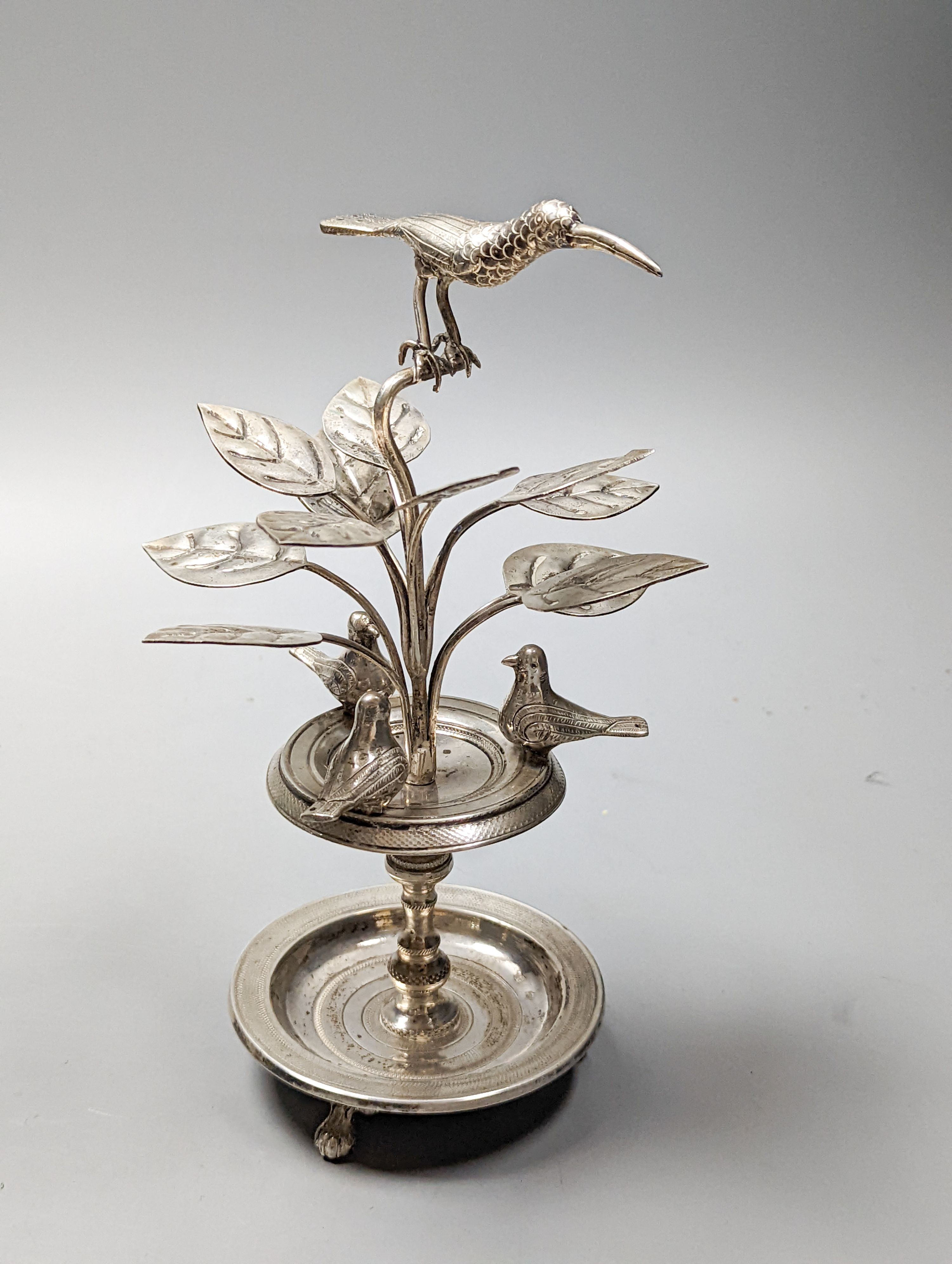 Tw South American? white metal toothpick holders?, modelled as a floral displays with circular bases, one with birds